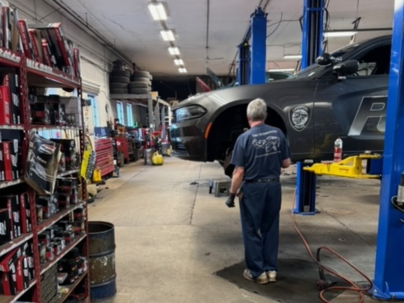 brakes near liverpool ny image of first automotive technician working on front brake in garage