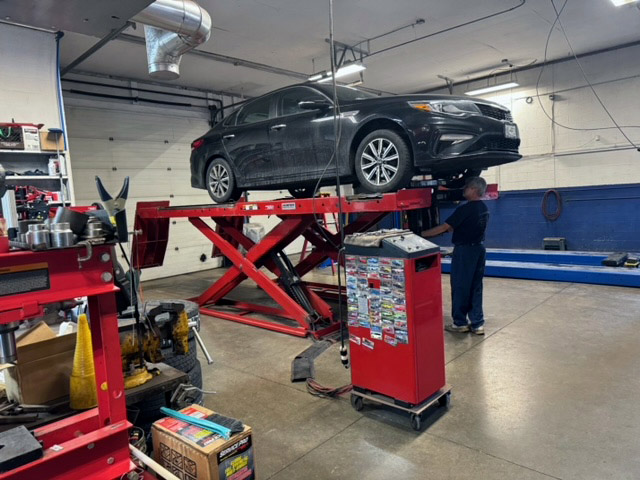 oil change near liverpool ny from first automotive car lifted for an oil change