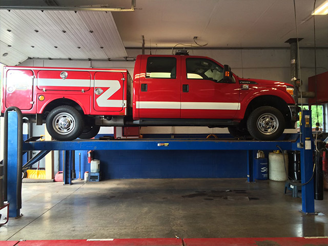 fleet repair near liverpool ny from first automotive fleet repair vehicle being lifted